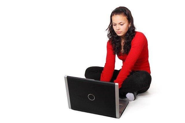 A person sitting on a computer
Description automatically generated with medium confidence